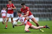 11 June 2022; Shea Birt of Derry in action against Colm Geary of Cork during the Electric Ireland GAA Football All-Ireland Minor Championship Quarter-Final match between Cork and Derry at MW Hire O'Moore Park in Portlaoise, Laois. Photo by David Fitzgerald/Sportsfile
