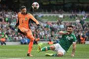 11 June 2022; Scotland goalkeeper Craig Gordon is tackled by Scott Hogan of Republic of Ireland during the UEFA Nations League B group 1 match between Republic of Ireland and Scotland at the Aviva Stadium in Dublin. Photo by Seb Daly/Sportsfile