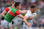 11 June 2022; Ben McCormack of Kildare is tackled by Stephen Coen of Mayo  during the GAA Football All-Ireland Senior Championship Round 2 match between Mayo and Kildare at Croke Park in Dublin. Photo by Ray McManus/Sportsfile