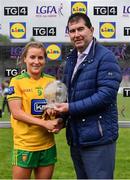 11 June 2022; Niamh McLaughlin of Donegal receives the Player of the Match award from Mícheál Naughton, LGFA President, after the TG4 All-Ireland Ladies Football Senior Championship Group D - Round 1 match between Donegal and Waterford at St Brendan's Park in Birr, Offaly. Photo by Sam Barnes/Sportsfile