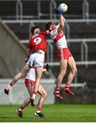 11 June 2022; Ruairi Forbes of Derry in action against Colm Gillespie of Cork during the Electric Ireland GAA Football All-Ireland Minor Championship Quarter-Final match between Cork and Derry at MW Hire O'Moore Park in Portlaoise, Laois. Photo by David Fitzgerald/Sportsfile