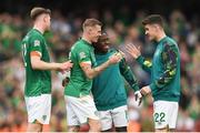 11 June 2022; Republic of Ireland players, from left, Nathan Collins, James McClean, Michael Obafemi and Darragh Lenihan after their side's victory in the UEFA Nations League B group 1 match between Republic of Ireland and Scotland at the Aviva Stadium in Dublin. Photo by Eóin Noonan/Sportsfile