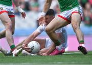 11 June 2022; Ben McCormack of Kildare gathers possession ahead of Mayo players Oisín Mullin, right, and Pádraig O'Horan, before referee Derek O'Mahoney gave a free against him for picking the ball off the ground during the GAA Football All-Ireland Senior Championship Round 2 match between Mayo and Kildare at Croke Park in Dublin. Photo by Piaras Ó Mídheach/Sportsfile