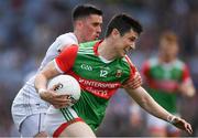 11 June 2022; Conor Loftus of Mayo is tackled by Mick O'Grady of Kildare  during the GAA Football All-Ireland Senior Championship Round 2 match between Mayo and Kildare at Croke Park in Dublin. Photo by Ray McManus/Sportsfile