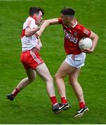 11 June 2022; Gearoid Daly of Cork in action against Shea Birt of Derry during the Electric Ireland GAA Football All-Ireland Minor Championship Quarter-Final match between Cork and Derry at MW Hire O'Moore Park in Portlaoise, Laois. Photo by David Fitzgerald/Sportsfile