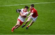11 June 2022; Johnny McGuckian of Derry in action against Ed Myers of Cork during the Electric Ireland GAA Football All-Ireland Minor Championship Quarter-Final match between Cork and Derry at MW Hire O'Moore Park in Portlaoise, Laois. Photo by David Fitzgerald/Sportsfile