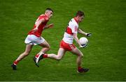 11 June 2022; Odhran Murphy of Derry in action against Kieran McCarthy of Cork during the Electric Ireland GAA Football All-Ireland Minor Championship Quarter-Final match between Cork and Derry at MW Hire O'Moore Park in Portlaoise, Laois. Photo by David Fitzgerald/Sportsfile