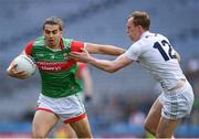 11 June 2022; Oisín Mullin of Mayo goes past Paul Cribbin of Kildare on his way to score a goal during the GAA Football All-Ireland Senior Championship Round 2 match between Mayo and Kildare at Croke Park in Dublin. Photo by Ray McManus/Sportsfile
