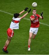 11 June 2022; Neville O'Leary of Cork in action against Cahair Spiers of Derry during the Electric Ireland GAA Football All-Ireland Minor Championship Quarter-Final match between Cork and Derry at MW Hire O'Moore Park in Portlaoise, Laois. Photo by David Fitzgerald/Sportsfile