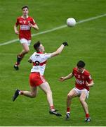 11 June 2022; Dara McPeake of Derry in action against Bryan Hayes of Cork during the Electric Ireland GAA Football All-Ireland Minor Championship Quarter-Final match between Cork and Derry at MW Hire O'Moore Park in Portlaoise, Laois. Photo by David Fitzgerald/Sportsfile