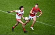 11 June 2022; Cahair Spiers of Derry in action against Neville O'Leary of Cork during the Electric Ireland GAA Football All-Ireland Minor Championship Quarter-Final match between Cork and Derry at MW Hire O'Moore Park in Portlaoise, Laois. Photo by David Fitzgerald/Sportsfile
