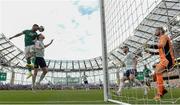 11 June 2022; Scott Hogan of Republic of Ireland heads at goal, which was subsequently disallowed, despite the efforts of Andy Robertson of Scotland, during the UEFA Nations League B group 1 match between Republic of Ireland and Scotland at the Aviva Stadium in Dublin. Photo by Stephen McCarthy/Sportsfile