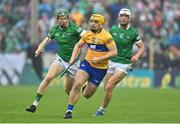 5 June 2022; Mark Rodgers of Clare in action against William O'Donoghue and Kyle Hayes of Limerick during the Munster GAA Hurling Senior Championship Final match between Limerick and Clare at FBD Semple Stadium in Thurles, Tipperary. Photo by Brendan Moran/Sportsfile