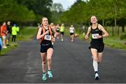 12 June 2022; Sile O'Byrne of Sli Cualann AC, Wicklow, left, on her way to finishing second in the national championships and women's overall event, ahead of Seanie Meyler of Omagh Harriers, Tyrone, during the Irish Runner 5 Mile incorporating the AAI National 5 Mile Championships at Phoenix Park in Dublin. Photo by Sam Barnes/Sportsfile