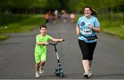 12 June 2022; Claire Learmouth and her son Max, aged 6, from Sheriff Street in Dublin,  during the Irish Runner 5 Mile incorporating the AAI National 5 Mile Championships at Phoenix Park in Dublin. Photo by Sam Barnes/Sportsfile
