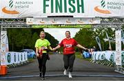 12 June 2022; Noreen Power, left, and Martina Sweeney cross the finish line during the Irish Runner 5 Mile incorporating the AAI National 5 Mile Championships at Phoenix Park in Dublin. Photo by Sam Barnes/Sportsfile