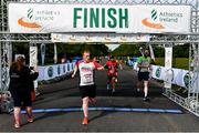 12 June 2022; Mark Redmond of LSA, Dublin, crosses the finish line during the Irish Runner 5 Mile incorporating the AAI National 5 Mile Championships at Phoenix Park in Dublin. Photo by Sam Barnes/Sportsfile