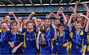 8 June 2022; St Patrick's BNS Drumcondra captain Luke Coughlan holds the cup as he celebrates with teammates after beating St Fiachra's NS Beamount in the Corn FODH final during the Allianz Cumann na mBunscoil Hurling Finals in Croke Park, Dublin. Over 2,800 schools and 200,000 students are set to compete in the primary schools competition this year with finals taking place across the country. Allianz and Cumann na mBunscol are also gifting 500 footballs, 200 hurleys and 200 sliotars to schools across the country to welcome Ukrainian students into our national games and local communities. Photo by Piaras Ó Mídheach/Sportsfile