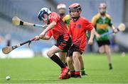 8 June 2022; Michael Mallon of Holy Trinity SNS scores a goal against Scoil Oilibheir, Coolmine, during the Corn Tom Ryder cup final at the Allianz Cumann na mBunscoil Hurling Finals in Croke Park, Dublin. Over 2,800 schools and 200,000 students are set to compete in the primary schools competition this year with finals taking place across the country. Allianz and Cumann na mBunscol are also gifting 500 footballs, 200 hurleys and 200 sliotars to schools across the country to welcome Ukrainian students into our national games and local communities. Photo by Piaras Ó Mídheach/Sportsfile
