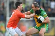 12 June 2022; Michael Murphy of Donegal is tackled by Aidan Forker of Armagh during the GAA Football All-Ireland Senior Championship Round 2 match between between Donegal and Armagh at St Tiernach's Park in Clones, Monaghan. Photo by Ramsey Cardy/Sportsfile