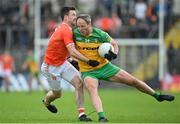 12 June 2022; Michael Murphy of Donegal is tackled by Aidan Forker of Armagh during the GAA Football All-Ireland Senior Championship Round 2 match between between Donegal and Armagh at St Tiernach's Park in Clones, Monaghan. Photo by Ramsey Cardy/Sportsfile