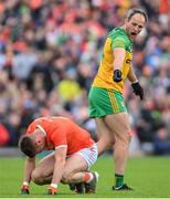 12 June 2022; Michael Murphy of Donegal and Greg McCabe of Armagh during the GAA Football All-Ireland Senior Championship Round 2 match between between Donegal and Armagh at St Tiernach's Park in Clones, Monaghan. Photo by Ramsey Cardy/Sportsfile