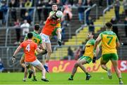 12 June 2022; Ben Crealey of Armagh in action against Jason McGee of Donegal during the GAA Football All-Ireland Senior Championship Round 2 match between between Donegal and Armagh at St Tiernach's Park in Clones, Monaghan. Photo by Ramsey Cardy/Sportsfile