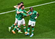 11 June 2022; Michael Obafemi of Republic of Ireland celebrates with teammates, from left, Alan Browne, Jason Knight and Troy Parrott, after scoring his side's third goal during the UEFA Nations League B group 1 match between Republic of Ireland and Scotland at the Aviva Stadium in Dublin. Photo by Ben McShane/Sportsfile
