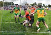 12 June 2022; Aidan Nugent of Armagh is fouled by Donegal goalkeeper Shaun Patton, resulting in a penalty for Armagh and black card for Shaun Patton, during the GAA Football All-Ireland Senior Championship Round 2 match between between Donegal and Armagh at St Tiernach's Park in Clones, Monaghan. Photo by Seb Daly/Sportsfile