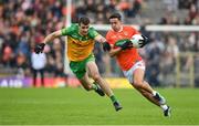 12 June 2022; Stefan Campbell of Armagh in action against Caolan McGonagle of Donegal during the GAA Football All-Ireland Senior Championship Round 2 match between between Donegal and Armagh at St Tiernach's Park in Clones, Monaghan. Photo by Seb Daly/Sportsfile