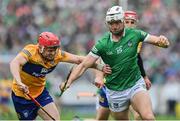 5 June 2022; Kyle Hayes of Limerick is tackled by .c4 during the Munster GAA Hurling Senior Championship Final match between Limerick and Clare at FBD Semple Stadium in Thurles, Tipperary. Photo by Brendan Moran/Sportsfile