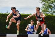 4 June 2022; Sean McGinley of St Eunans Letterkenny, Donegal, right, on his way to winning the senior boys 2000m steeplechase, ahead of Marcus Clarke of Castleknock College, Dublin, left,  at the Irish Life Health All Ireland Schools Track and Field Championships at Tullamore in Offaly. Photo by Sam Barnes/Sportsfile