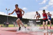 4 June 2022; Billy Coogan of Kilkenny CBS, left, on his way to winning the intermediate boys 1500m steeplechase at the Irish Life Health All Ireland Schools Track and Field Championships at Tullamore in Offaly. Photo by Sam Barnes/Sportsfile