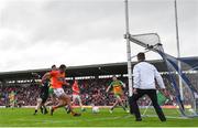 12 June 2022; Stephen Sheridan of Armagh shoots to score his side's third goal past Donegal goalkeeper Shaun Patton during the GAA Football All-Ireland Senior Championship Round 2 match between between Donegal and Armagh at St Tiernach's Park in Clones, Monaghan. Photo by Ramsey Cardy/Sportsfile