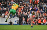 12 June 2022; Armagh goalkeeper Ethan Rafferty is fouled by Caolan McGonagle of Donegal during the GAA Football All-Ireland Senior Championship Round 2 match between between Donegal and Armagh at St Tiernach's Park in Clones, Monaghan. Photo by Seb Daly/Sportsfile