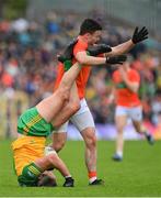 12 June 2022; Michael Murphy of Donegal tussles with Aidan Forker of Armagh during the GAA Football All-Ireland Senior Championship Round 2 match between between Donegal and Armagh at St Tiernach's Park in Clones, Monaghan. Photo by Seb Daly/Sportsfile