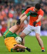 12 June 2022; Michael Murphy of Donegal tussles with Aidan Forker of Armagh during the GAA Football All-Ireland Senior Championship Round 2 match between between Donegal and Armagh at St Tiernach's Park in Clones, Monaghan. Photo by Seb Daly/Sportsfile