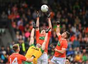 12 June 2022; Andrew Murnin, centre, and Greg McCabe of Armagh in action against Caolan McGonagle of Donegal during the GAA Football All-Ireland Senior Championship Round 2 match between between Donegal and Armagh at St Tiernach's Park in Clones, Monaghan. Photo by Seb Daly/Sportsfile