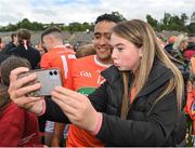 12 June 2022; Jemar Hall of Armagh takes a selfie with a supporter after the GAA Football All-Ireland Senior Championship Round 2 match between between Donegal and Armagh at St Tiernach's Park in Clones, Monaghan. Photo by Seb Daly/Sportsfile