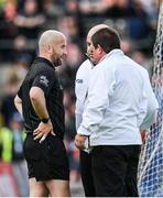 12 June 2022; Referee Brendan Cawley consults with his umpires before showing a black card to Shaun Patton and awarding a penalty to Armagh during the GAA Football All-Ireland Senior Championship Round 2 match between between Donegal and Armagh at St Tiernach's Park in Clones, Monaghan. Photo by Seb Daly/Sportsfile