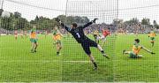 12 June 2022; Rory Grugan of Armagh scores his side's first goal, past Donegal goalkeeper Shaun Patton, during the GAA Football All-Ireland Senior Championship Round 2 match between between Donegal and Armagh at St Tiernach's Park in Clones, Monaghan. Photo by Seb Daly/Sportsfile