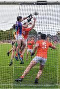 12 June 2022; Armagh goalkeeper Ethan Rafferty and Rian O'Neill in action against Jason McGee of Donegal during the GAA Football All-Ireland Senior Championship Round 2 match between between Donegal and Armagh at St Tiernach's Park in Clones, Monaghan. Photo by Seb Daly/Sportsfile