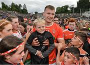 12 June 2022; Rian O'Neill of Armagh celebrates with supporters after the GAA Football All-Ireland Senior Championship Round 2 match between between Donegal and Armagh at St Tiernach's Park in Clones, Monaghan. Photo by Seb Daly/Sportsfile