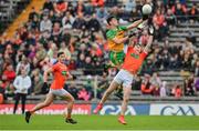 12 June 2022; Michael Langan of Donegal in action against Jarly Og Burns of Armagh during the GAA Football All-Ireland Senior Championship Round 2 match between between Donegal and Armagh at St Tiernach's Park in Clones, Monaghan. Photo by Seb Daly/Sportsfile