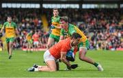 12 June 2022; Stefan Campbell of Armagh in action against Peadar Mogan of Donegal during the GAA Football All-Ireland Senior Championship Round 2 match between between Donegal and Armagh at St Tiernach's Park in Clones, Monaghan. Photo by Seb Daly/Sportsfile