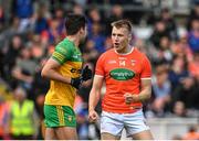 12 June 2022; Rian O'Neill of Armagh celebrates in front of Donegal's Brendan McCole after scoring his side's second goal via a penalty during the GAA Football All-Ireland Senior Championship Round 2 match between between Donegal and Armagh at St Tiernach's Park in Clones, Monaghan. Photo by Seb Daly/Sportsfile