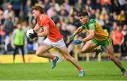 12 June 2022; Jason Duffy of Armagh in action against Odhran McFadden Ferry of Donegal during the GAA Football All-Ireland Senior Championship Round 2 match between between Donegal and Armagh at St Tiernach's Park in Clones, Monaghan. Photo by Seb Daly/Sportsfile