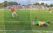 12 June 2022; Rian O'Neill of Armagh celebrates after scoring his side's second goal via a penalty, past Caolan McGonagle of Donegal, during the GAA Football All-Ireland Senior Championship Round 2 match between between Donegal and Armagh at St Tiernach's Park in Clones, Monaghan. Photo by Seb Daly/Sportsfile