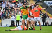 12 June 2022; Michael Murphy of Donegal tussles with Stephen Sheridan of Armagh during the GAA Football All-Ireland Senior Championship Round 2 match between between Donegal and Armagh at St Tiernach's Park in Clones, Monaghan. Photo by Seb Daly/Sportsfile