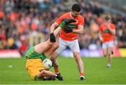 12 June 2022; Michael Murphy of Donegal tussles with Aidan Forker of Armagh during the GAA Football All-Ireland Senior Championship Round 2 match between between Donegal and Armagh at St Tiernach's Park in Clones, Monaghan. Photo by Seb Daly/Sportsfile